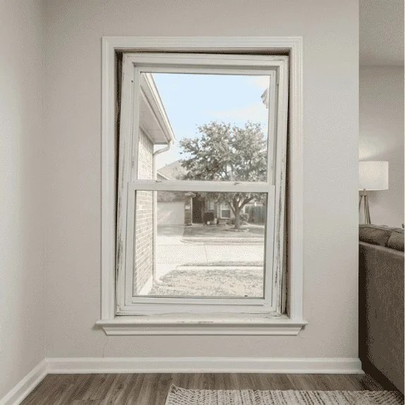 Window frame misalignment caused by foundation settlement in a residential home.